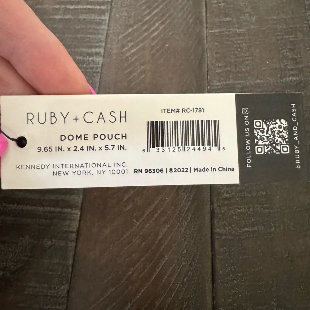 Ruby Cash animal print top zipper makeup bag. Black, tan and cream.